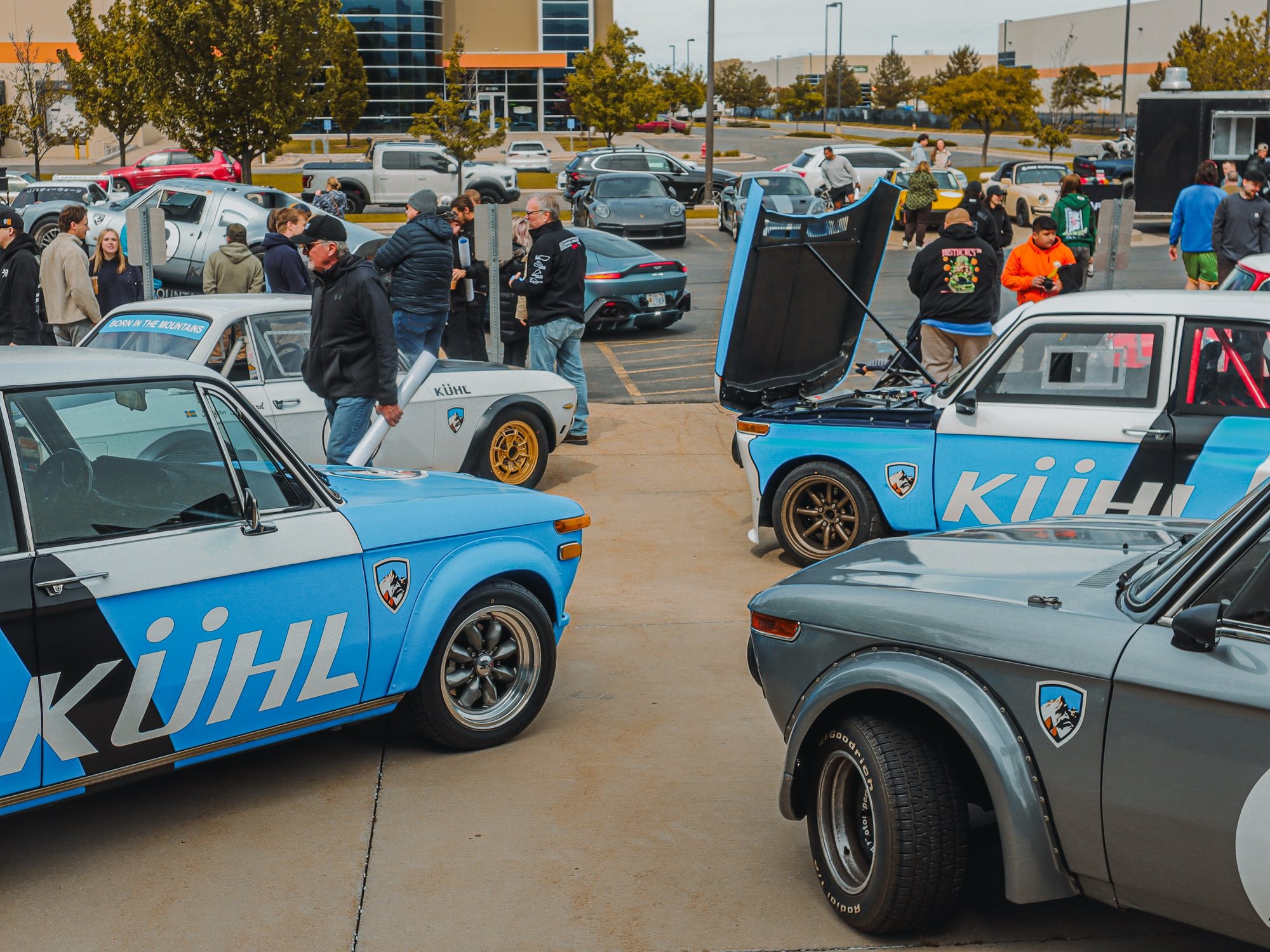 A crowd gathered around the KÜHL-liveried BMWs